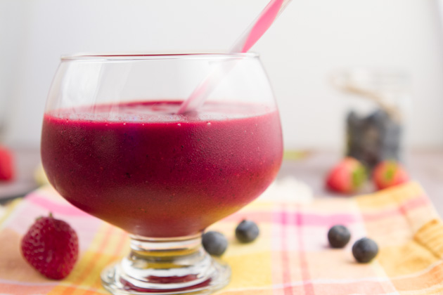 Fresh-pressed beet and apple juice with berries and banana